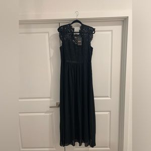 Pretty lace top evening dress. Floor length, zipper back closure . Never worn.